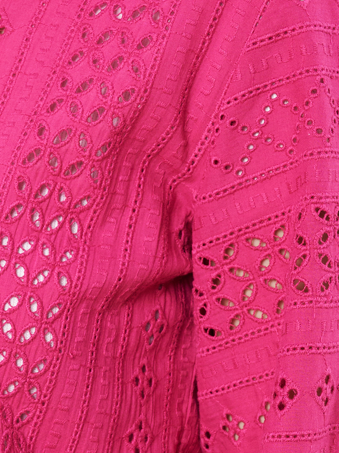Close-up of magenta Schiffli cotton fabric
