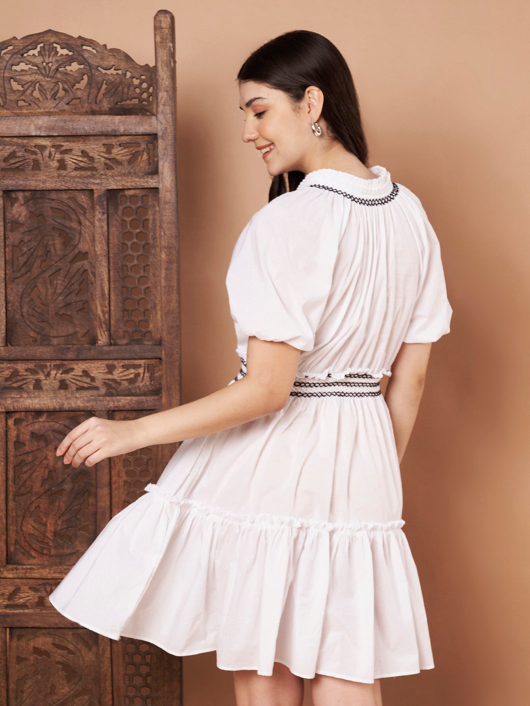 Back view of white cotton dress for women – tiered skirt and puff sleeves