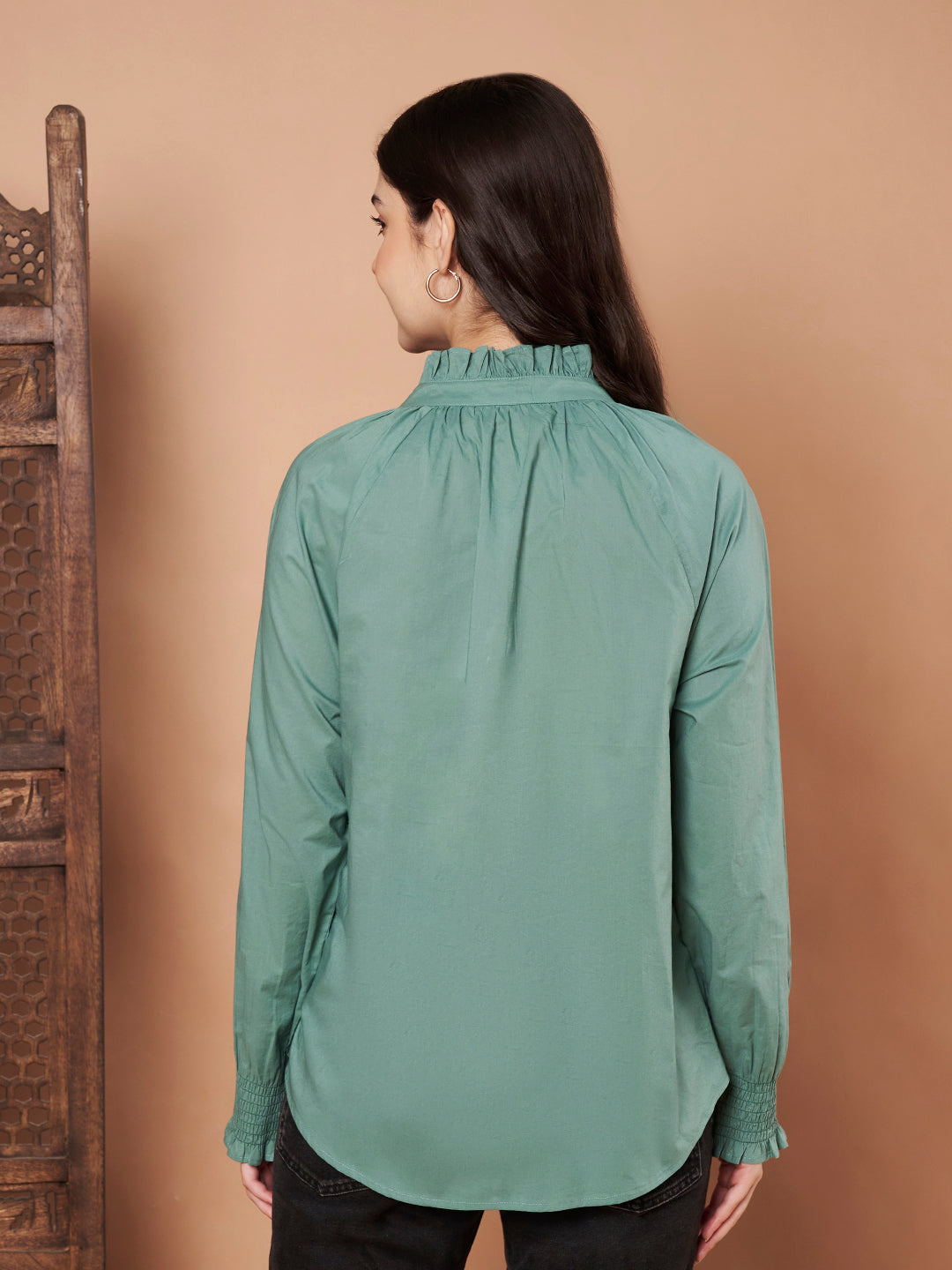 Back view of womenβs green cotton ruffle neck shirt β 100% cotton