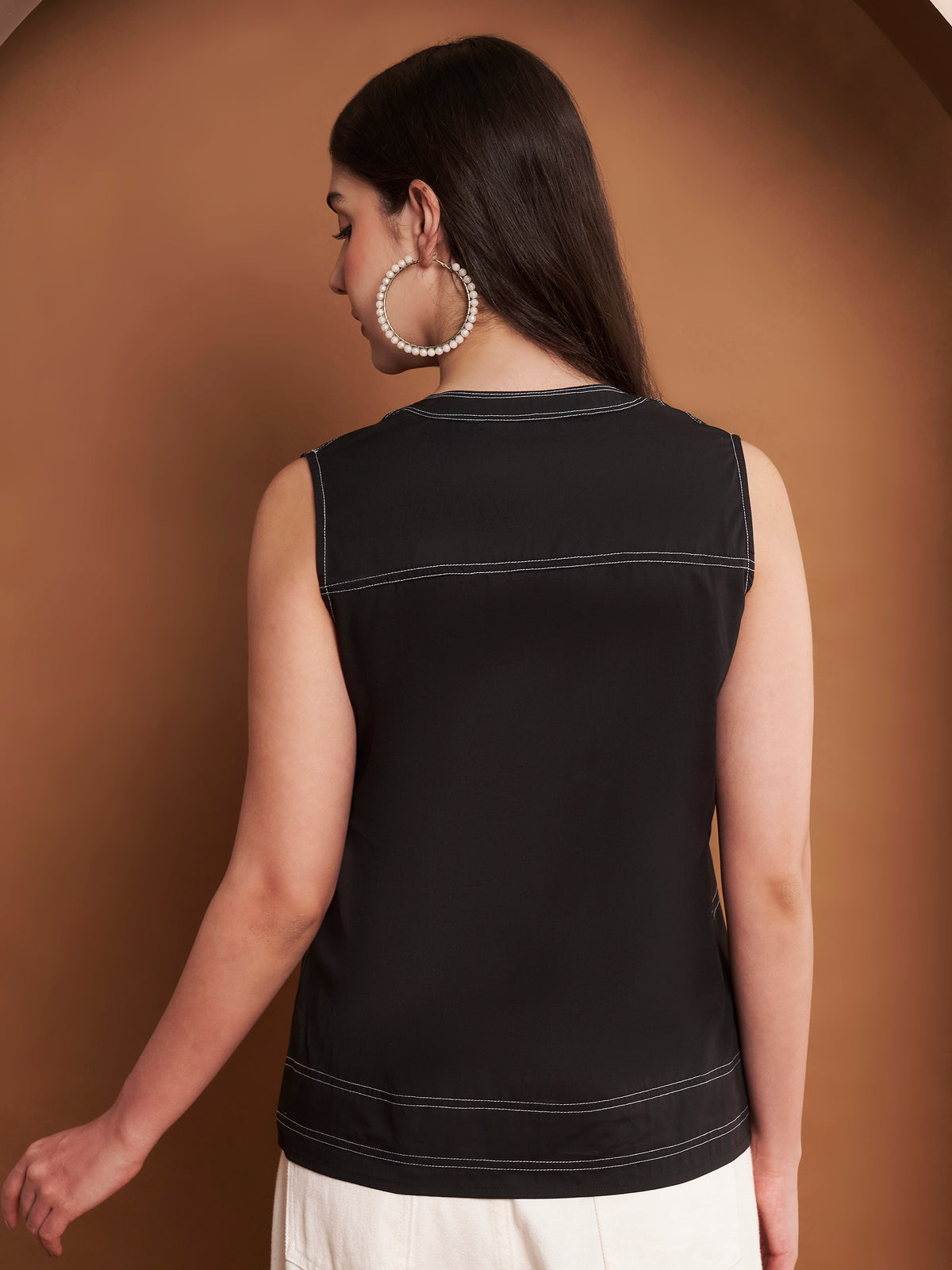 Back view of womenβs blue cotton pleated mandarin collar top