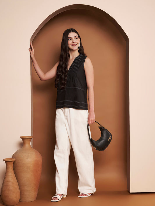 Model wearing blue pleated cotton top with mandarin collar