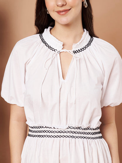 Close-up of puff sleeves on white cotton dress – lightweight fabric