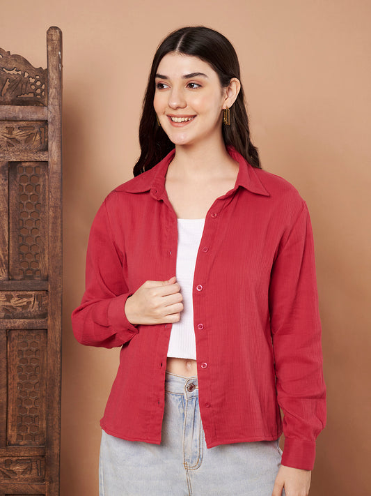 Model wearing red cotton long sleeve button-down top for women