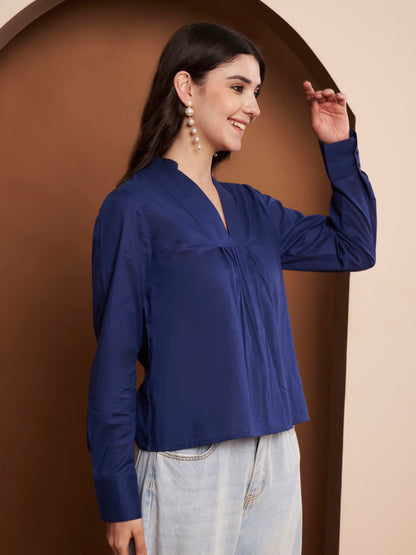 Right side of navy blue pleated cotton top – flowy pleats